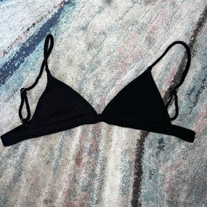 Bathing suit bottom and top. All black with cloth material.